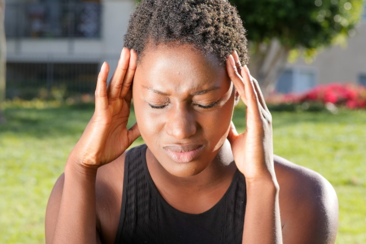 Electrolyte Imbalance woman with a headache