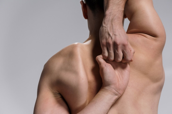 Types of Scoliosis man back and hands