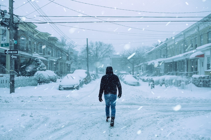 Arthritis Winter Flareups person walking in cold weather