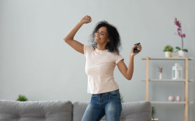 A test of your mental state: a woman dancing in the living room