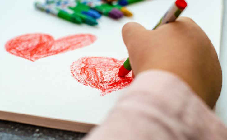 kid drawing a heart