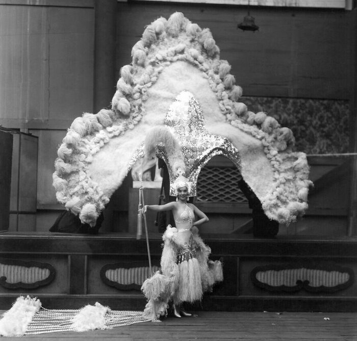 In 1934, actress Jessie Matthews wore a VERY big and elaborate headdress for the play "Evergreen."