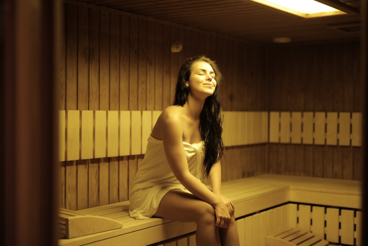 Sauna vs Steam Room woman in a Sauna