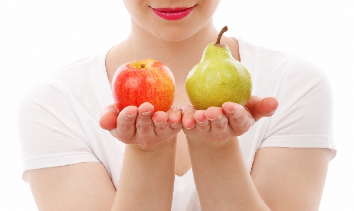 woman holding apple and pear