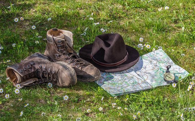Adventure test: map, shoes, hat and compass