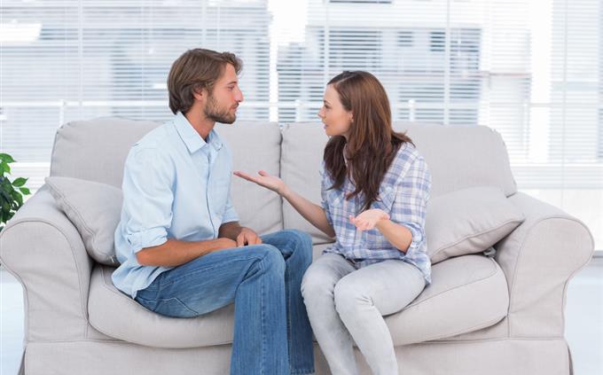 Toxic Relationship Test: A man and a woman talk on a couch