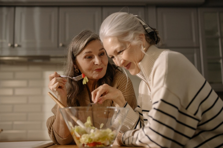 ADHD in Seniors two women chatting and eating salad