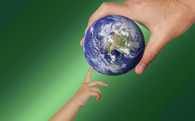 True False Test on World Geography: Illustration of a child's hand touching a globe