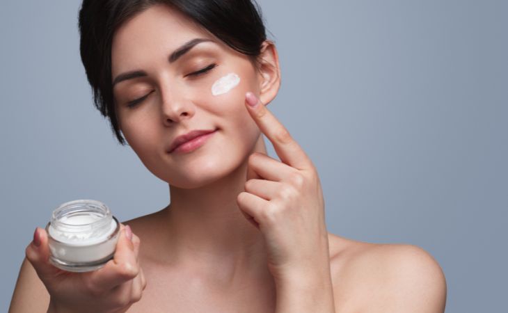 woman applying a skin cream