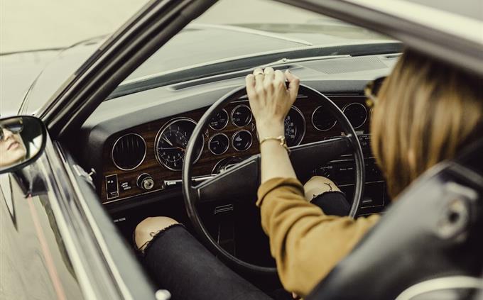 Test which car is suitable for you to drive: a woman in a car