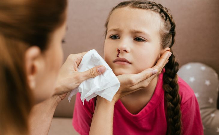 Causes, Treatment, and Prevention for Nosebleeds: Girl with a Nosebleed