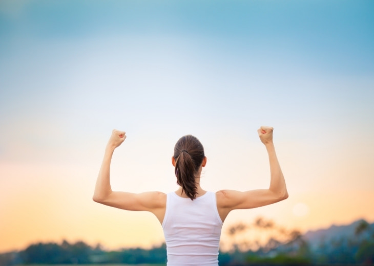 Benefits of Salicornia: Woman Flexing Muscles in Scenic Background