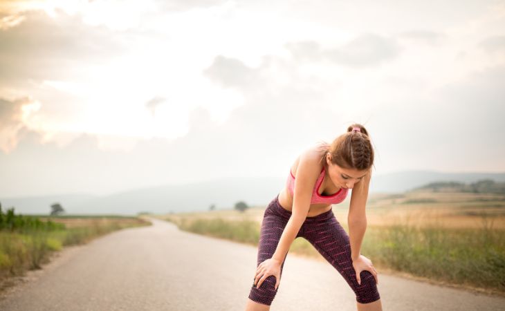 Effects of stopping physical activity: Tired woman during sport