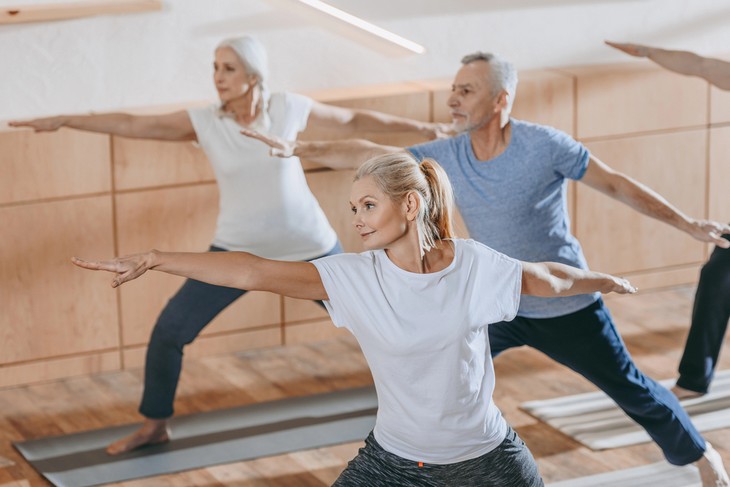 Signs of Slow or Rapid Brain Aging: Older individuals in a yoga class