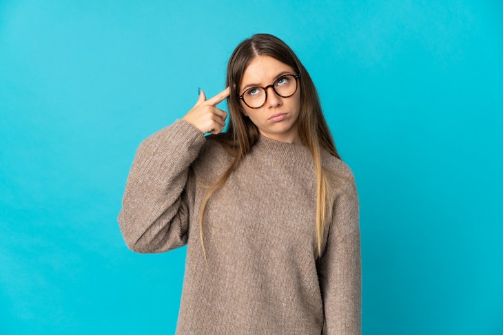 Signs of Slow or Rapid Brain Aging: Young woman rolling her eyes in frustration