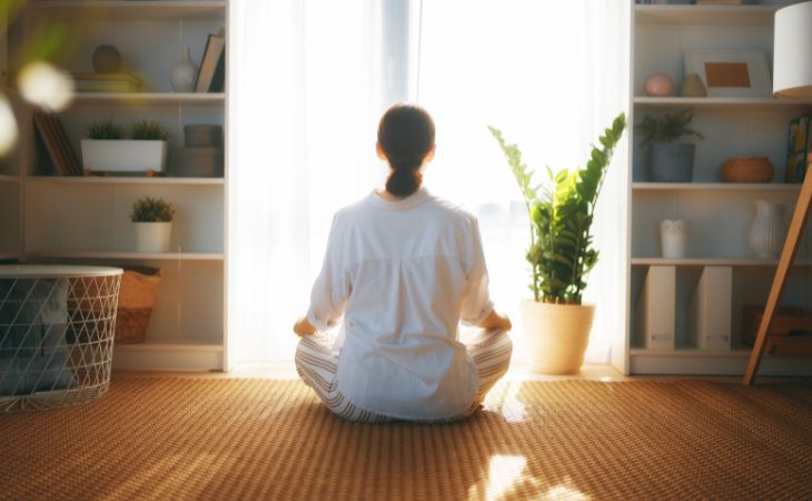 Exercises for coping with anxiety and PTSD: Woman meditating