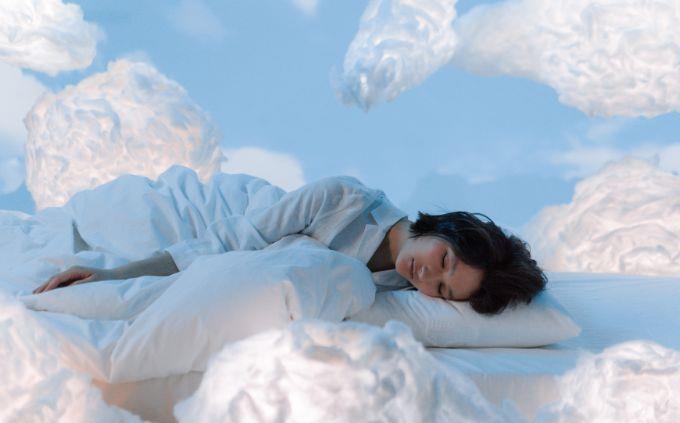Where will you be in 5 years according to your dreams: A woman sleeping between clouds