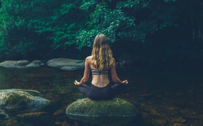 On what day of creation was your soul created: A woman meditating in a spring