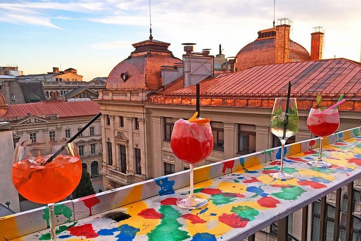 Attractions in Bucharest: Glasses on the Railing at Pura Vida Sky Bar