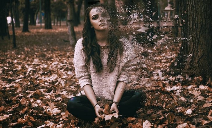 Things not to be ashamed of and hide from a therapist: A woman sits in autumn leaves and they crumble