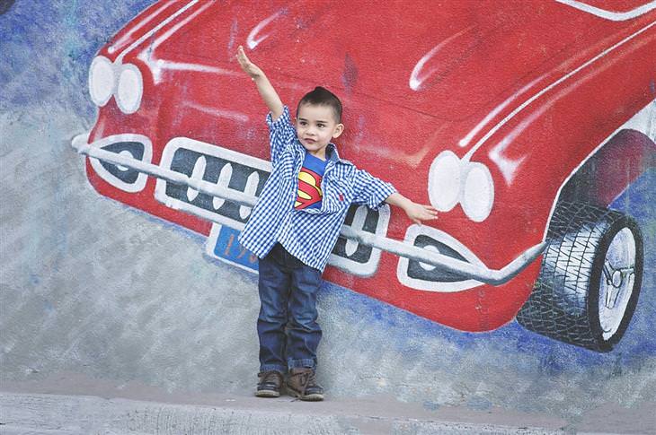 Questions to ask your kids: A boy wearing a Superman shirt