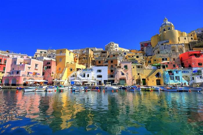 The Amalfi Coast in Italy: Boat marina with colorful houses by the water