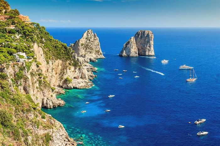 The Amalfi Coast in Italy: Cliffs and boats on the seashore