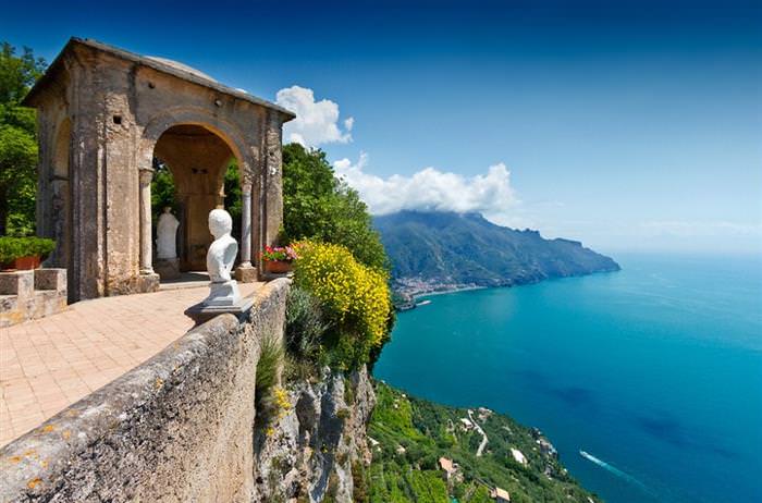 The Amalfi Coast in Italy: Ancient building against green cliffs and sea