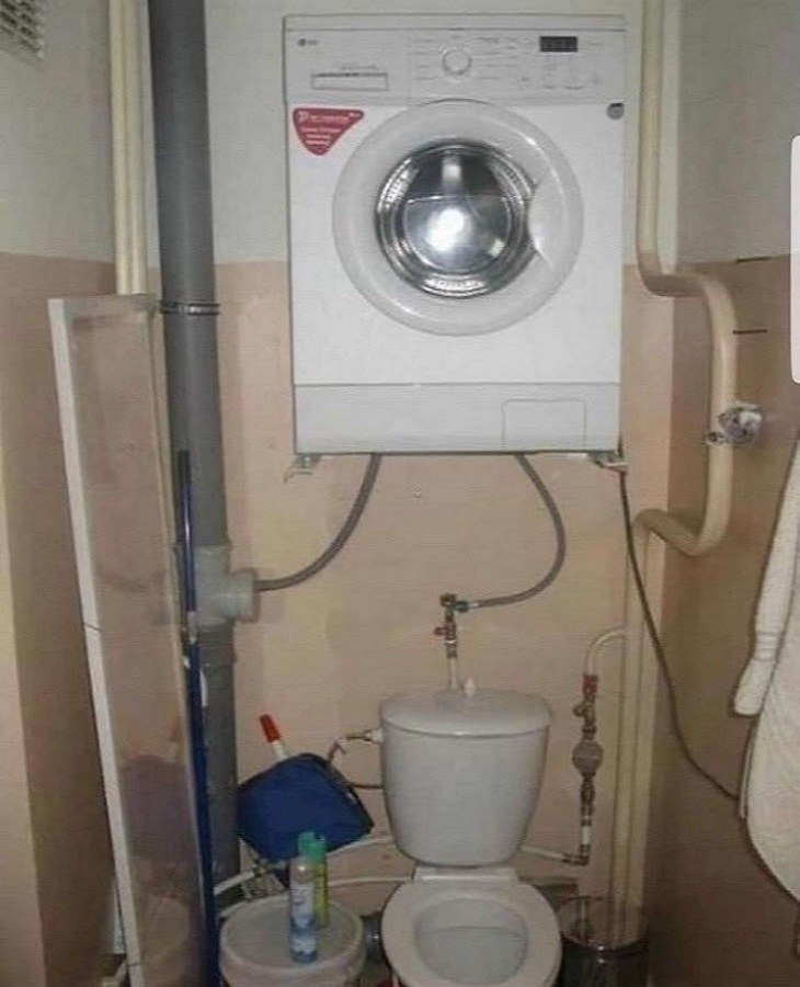 Bizarre Toilets: A toilet stall with a washing machine installed above it