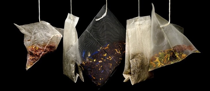 Tea bags hanging side by side