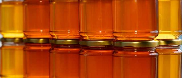 Jars of honey stacked on each other