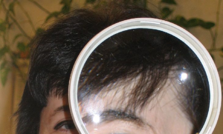 Hair health tests: hair under magnifying glass