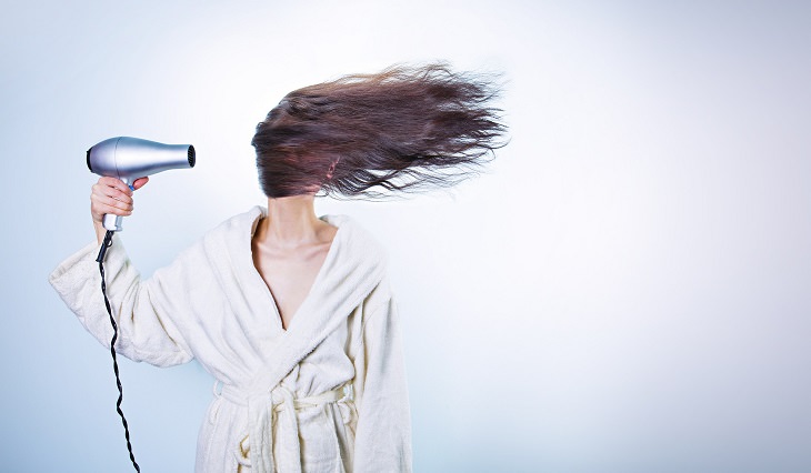 Hair health tests: funny picture of a woman drying her hair