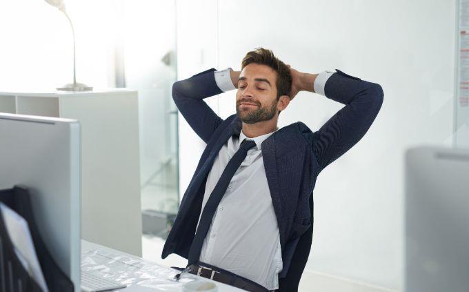 What is the legend that tells your life story: A man sits in an office with his hands behind his head