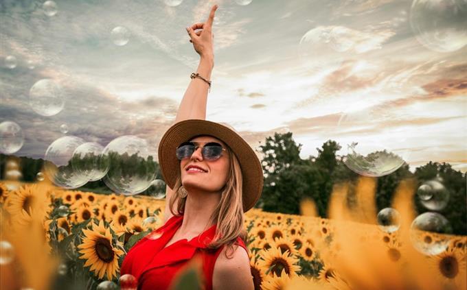 A test of inner strength: a woman in a sunflower field