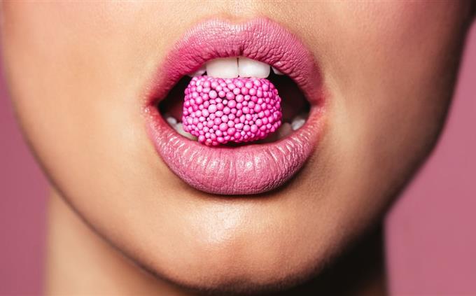 Pink Shade Personality Test: Woman with a lollipop in her mouth