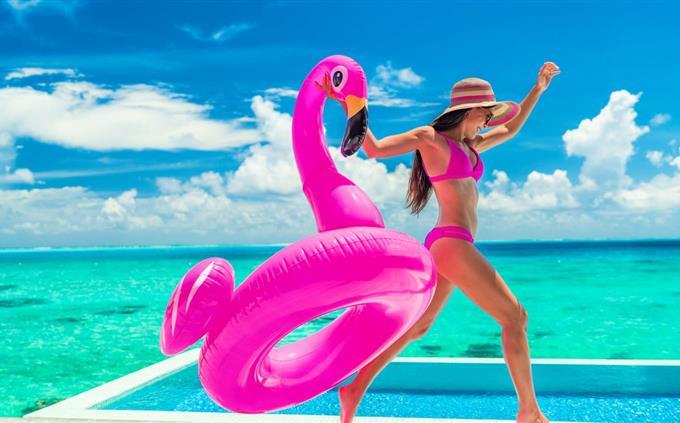 Pink tone personality test: A woman on vacation by a pool