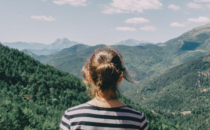 Are you hero, villain or anti hero: a woman looking at a mountainous landscape