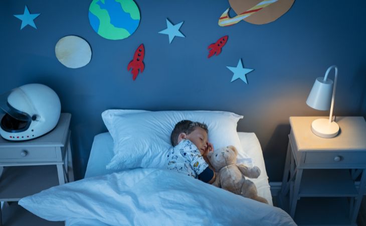 How parents harm their children’s sleep: a child sleeping in bed