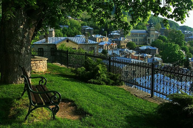 10 Picturesque Towns and Villages in Mainland Greece: A park overlooking the village of Nymfaio, Western Macedonia