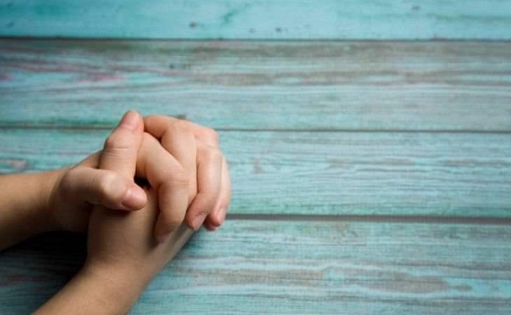 How to relieve pain with the power of thought: Hands in a prayer position