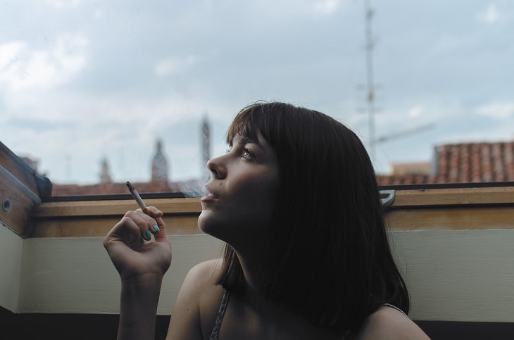 Coping with a stormy temper: a woman smoking a cigarette