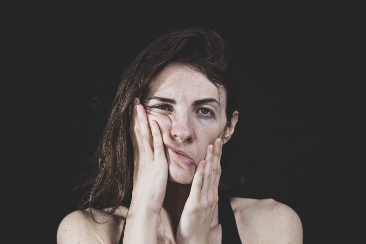 Coping with a stormy temper: a woman grimacing in frustration