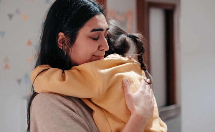 Why the child behaves less nicely specifically with you: A mother hugging a child
