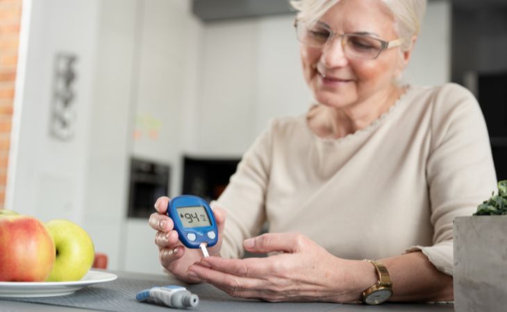 New Ways to Reduce Dementia Risk: An elderly woman checking her blood sugar