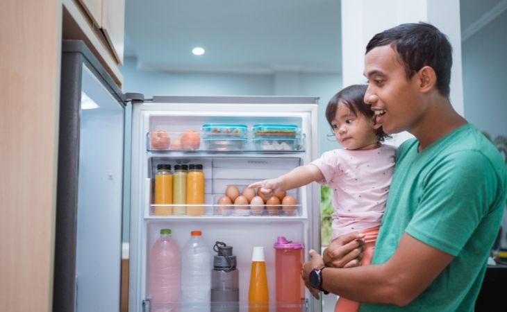 How to stop a child from whining: girl pointing at fridge