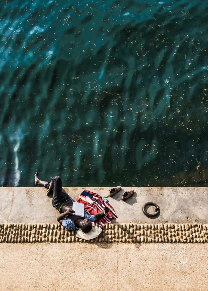 Photos from the 1839 Awards photography competition: Man lying on a pier