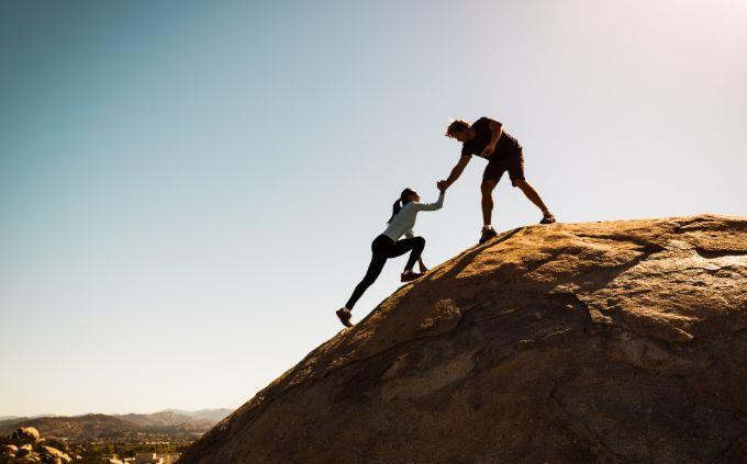 Which emotional plant are you: a man helps a woman get on a mountain