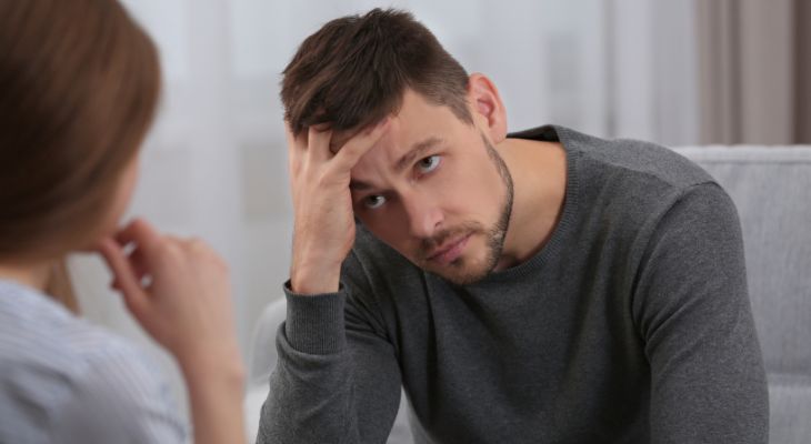 How to identify emotions and the message they convey: A woman talking to a man holding his head with his hand
