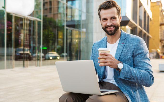 Which social network is suitable for your personality: a man sitting with a laptop outside